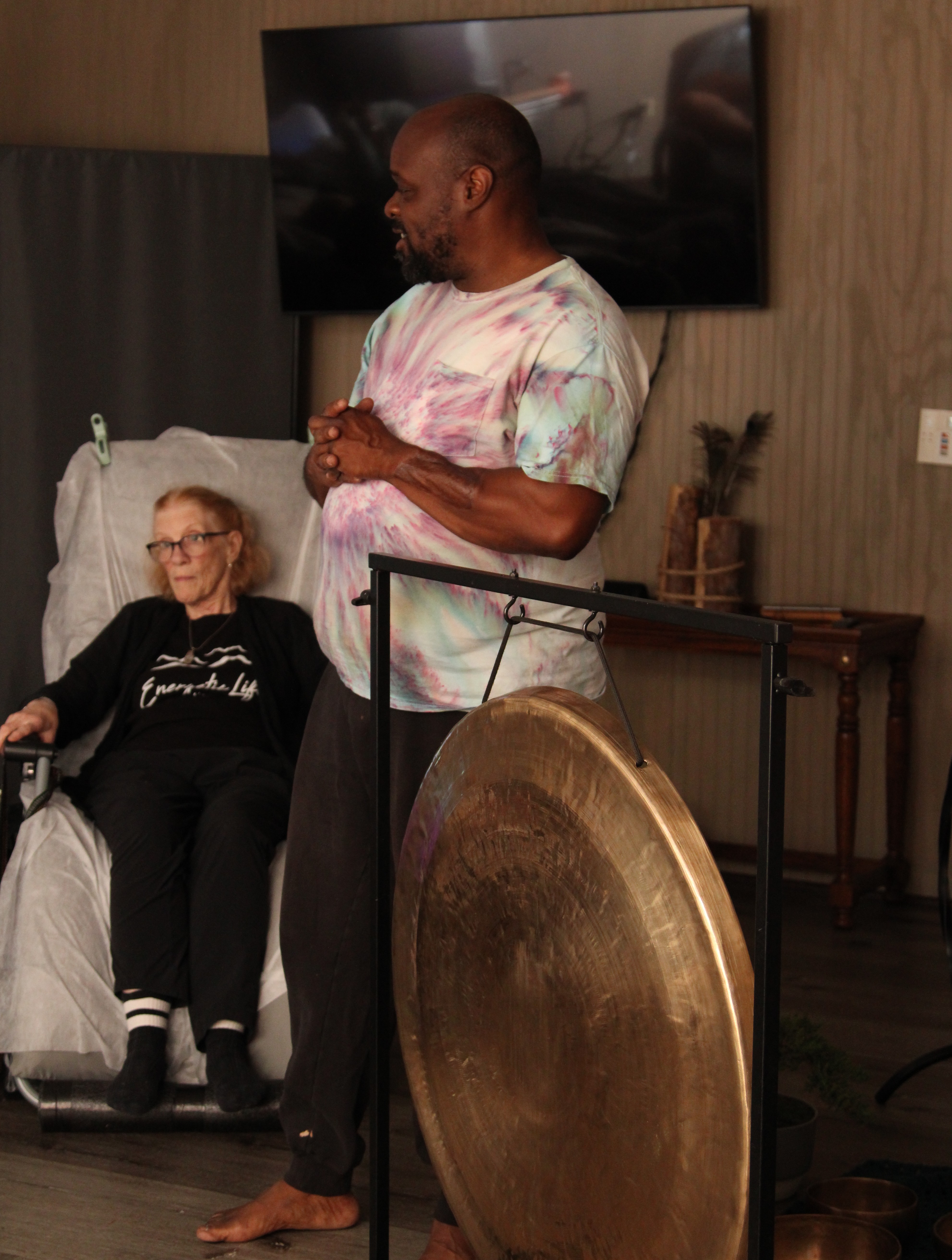 Sound bath in session with practitioner and guest