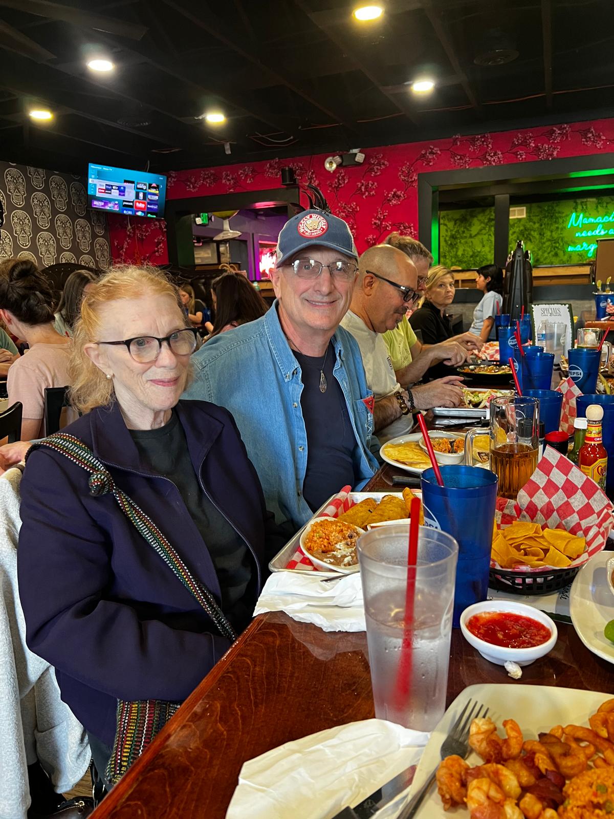 Dr. Melanie and a guest at a group dinner outing